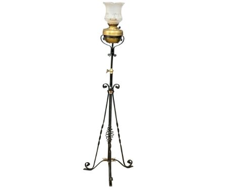 An early 20th century wrought iron floor lamp with brass bowl. 160cm 