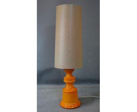A 20th century orange glazed pottery lamp with shade, H.115cm 