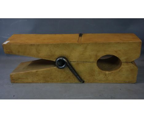 A contemporary ceramic novelty low table in the form of a coat peg, H.41 W.120 D.31cm 