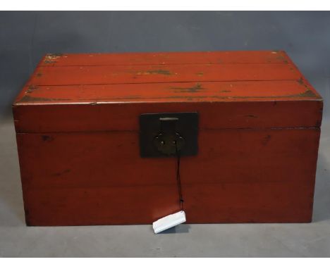A late 19th/early 20th century Chinese red lacquered trunk, H.36 W.77 D.48cm 