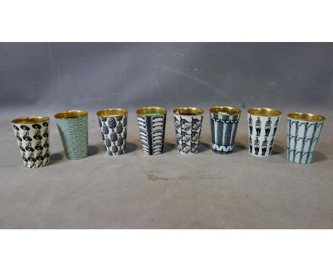A set of 8 ceramic beakers by Asa Lindstrom 