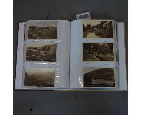 A collection of vintage post cards in an album 