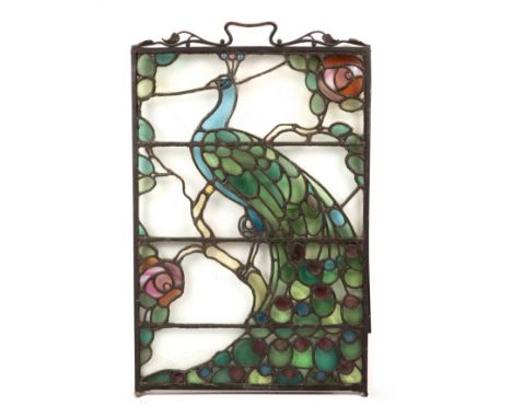 Arts and CraftsStained glass screendepicting a peacock80 x 50cm.  Does not stand on its own. No feet. Has bar to back to fix.