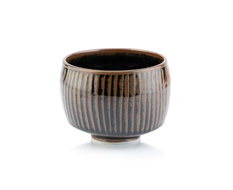 Geoffrey Whiting (1919-1988)Bowlporcelain, with tenmoku glaze and fluted designimpressed potter's seal mark to the base11cm h