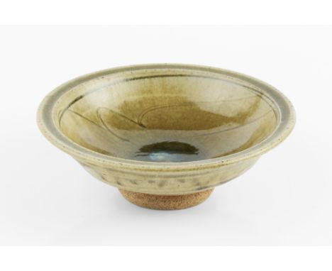 Jim Malone (b.1946)Footed bowlgreen ash glaze, the well with blue glaze and incised patternimpressed potter's seal18cm diamet