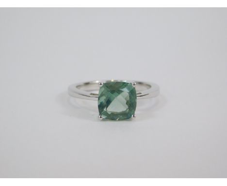 A silver and Tucson green fluorite ring, the cushion shaped stone in a claw setting, 2.48ct, size L/M, 2.39g, with certificat
