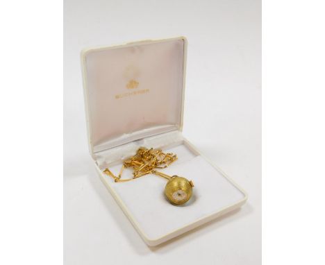 A Bucherer gilt metal ball shaped pendant watch, with a silvered dial and textured finish surface, on a box link neckchain wi