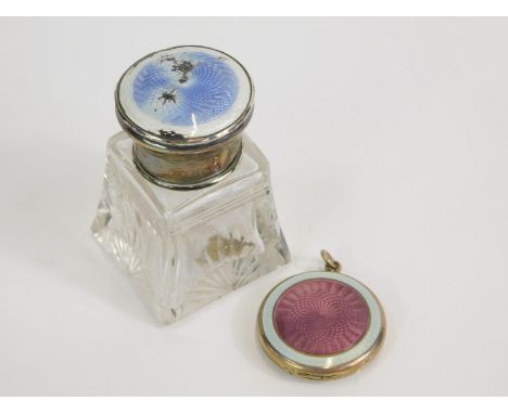 A George V cut glass smelling salts bottle, with silver screw lid, having turquoise blue and white guilloche enamel decoratio