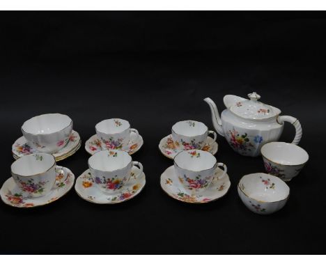 A Royal Crown Derby porcelain part tea service decorated in the Derby Posies pattern, comprising teapot, sugar bowl, five cup