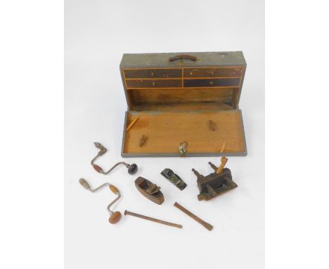 A carpenter's tool chest, containing moulding planes, Millers Falls No 75 plane, braces, and small tools, 21cm H, 78.5cm W, 4