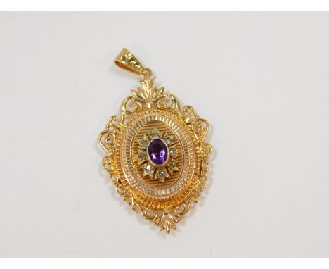 A 9ct gold amethyst and diamond locket pendant, of oval form with a central star burst, within an open work foliate border, 5