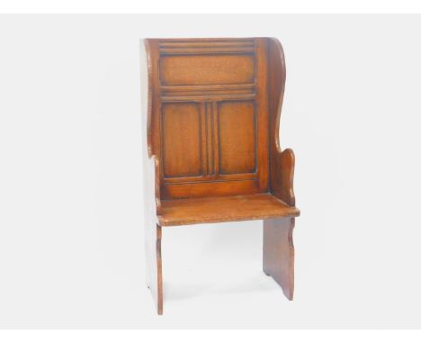 A 19thC oak lambing chair, with a triple panel back, and shaped wings, 61cm WIde.