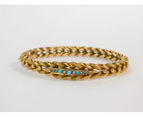 A 9ct gold seed pearl and turquoise set bangle, on a snap clasp with safety chain as fitted, 10.3g.