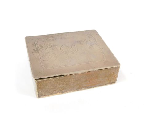 A silver cigarette box, with engine turned decoration, central engraved circular monogram reserve, twin division interior, in