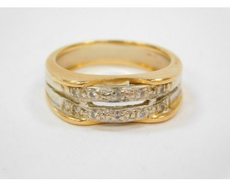 An 18ct two colour gold ring, with a double upper band pave set with colourless stones, hallmarks worn, size Q, 6.4g