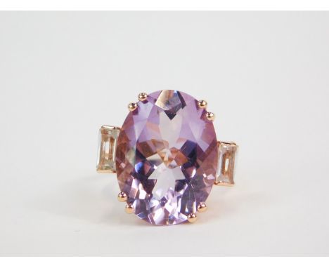 A silver gilt Rose de France amethyst and white topaz Rose Midas ring, the high claw set oval cut amethyst, 16ct, flanked by 