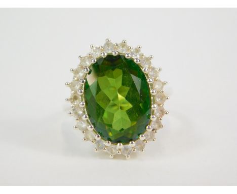 A silver fern green quartz and white topaz ring, claw set, topaz 9.22cts, size N/O, with certificate.