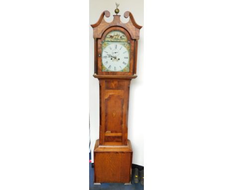 A George III oak and mahogany long case clock, the break arch dial painted with a horse race and floral spandrels, with Roman