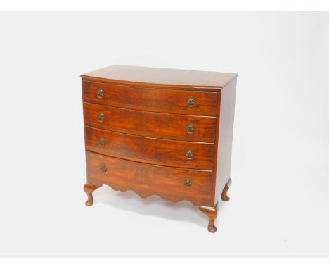 An early 20thC walnut bow front chest, of four long drawers, raised on cabriole legs, 82cm H, 82cm W, 47cm D.