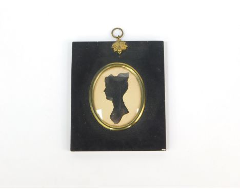 A 19thC silhouette portrait of a lady, attributed verso as Mrs Edward Whitemell, framed, 72mm x 36mm.