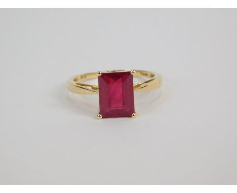 A 9ct gold and ruby solitaire ring, baguette cut, 3.54ct, size N, 1.62g gold, with certificate.