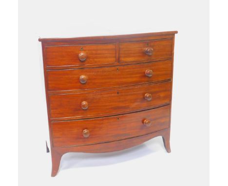 A Georgian mahogany bow front chest, of two short over three long graduated drawers, raised on splayed feet, 103.5cm H, 106cm