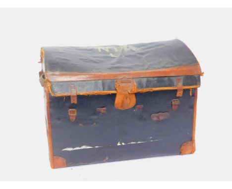 An early 20thC black canvass and tan leather domed cabin trunk, 63cm H, 83cm W, 55cm D.