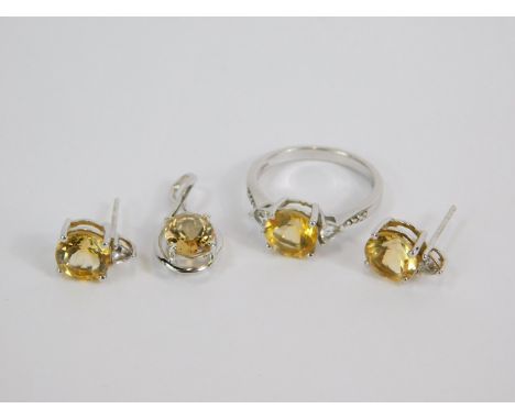 A silver Rio Grande citrine and white topaz jewellery set, comprising ring, size O, pendant and pair of earrings, with certif