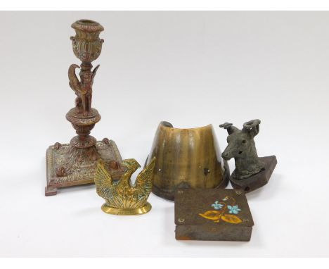 A French Empire patenated brass candlestick, cast to the stem with a sphinx, 20cm H, together with a horse's hoof, brass desk