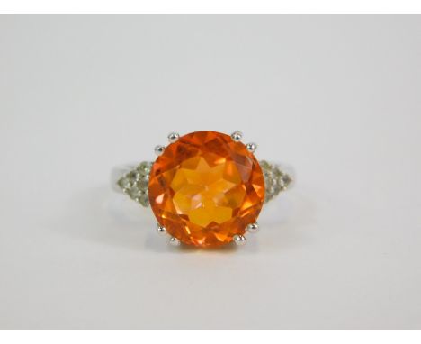 A silver Padparadscha quartz and white topaz ring, high claw set, quartz 6.22ct, size N/O, with certificate.