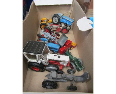 Three playworn Corgi diecast tractors, three Britains examples and another by Agrar together with a Lesney diecast combine ha