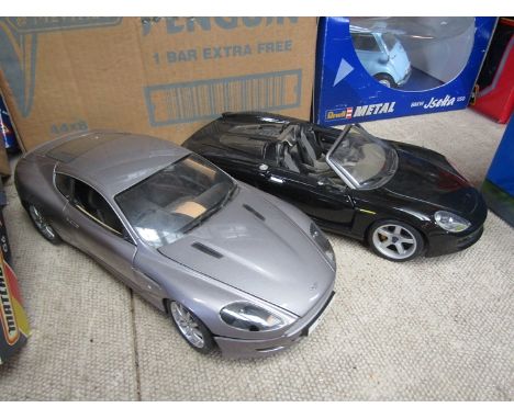 Two 1:18 scale diecast cars to include Minichamps Aston Martin DB9 Coupe and Maisto Porsche Carrera GT 