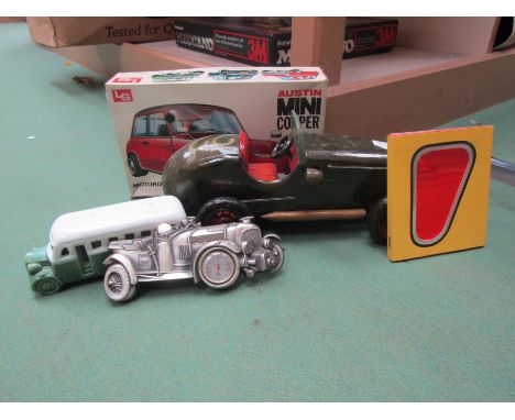 A wooden model racing car, kit built plastic Austin Mini Cooper, thermometer in the form of a Bentley, mini CD press kit and 