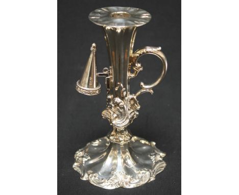 An early Victorian silver chamber stick, with scrolled and fluted body, scrolled handle, hallmarked Sheffield 1839, maker: He