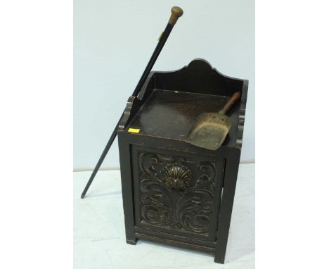 A late Victorian carved oak coal scuttle, together with a walking stick. (2)