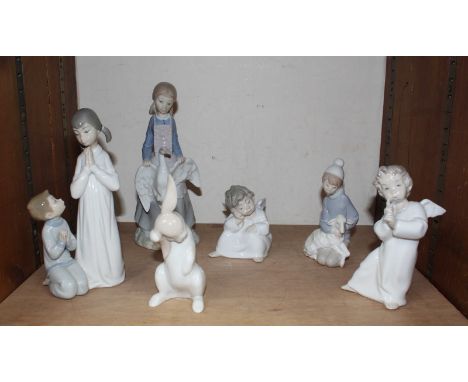 SECTION 29 - A small collection of six ceramic figures including four  Lladro pieces and two Nao items.