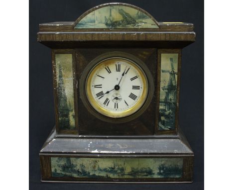 An unusual early 20th century novelty toffee tin modelled as a mantel clock, decorated with cityscapes and windmills, with Co