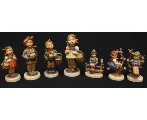 Seven 'Goebel,' Hummel ceramic figures of children.