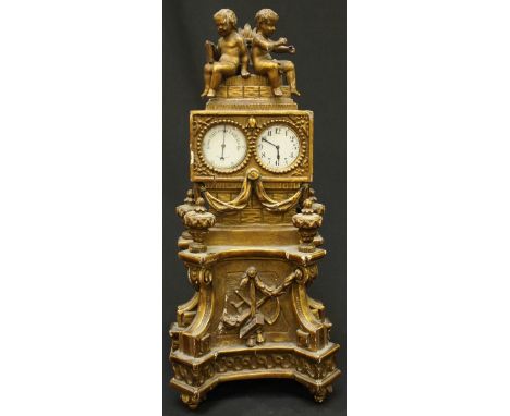 A Victorian carved gilt wood and gesso twin clock and barometer case, crested with two seated cherubs, the case decorated wit