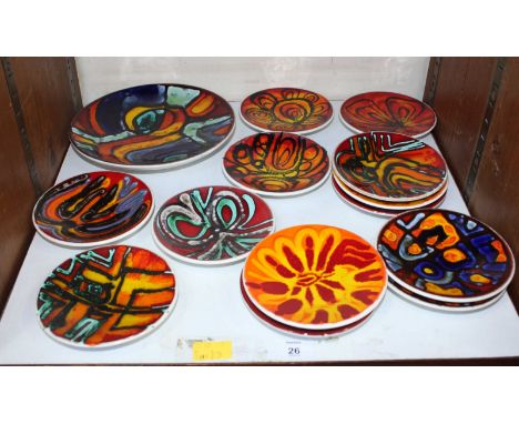 SECTION 26 - A collection of 13 Poole Pottery Delphis pattern pin dishes, all shape no. 49 together with a larger Poole Potte