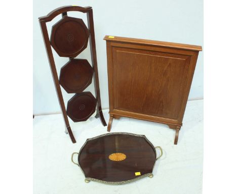 An Edwardian mahogany two handled tray of cartouche form with pierced silver plated gallery, together with a folding three ti