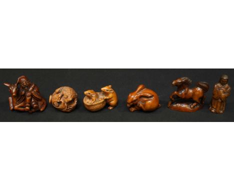 A collection of six Chinese carved boxwood netsuke, including a seated rabbit, a horse, standing figure, elder on a donkey, t