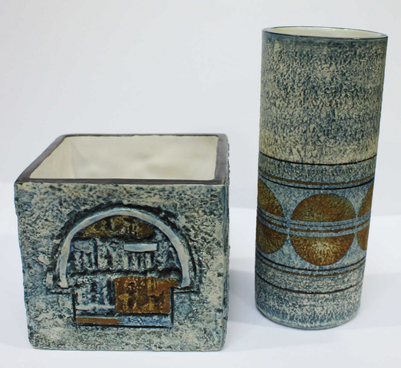 Two pieces of Troika pottery, a cylinder vase by Linda Hazel 14 cm high