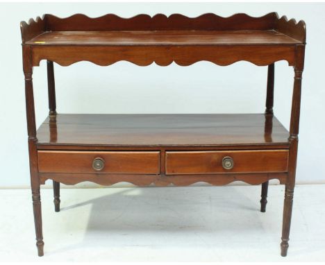 A 19th century mahogany wash stand, with galleried back and shelf over another open shelf with two drawers below and supporte