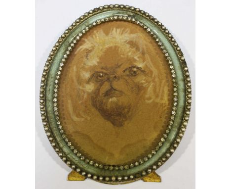 A late 19th century French watercolour portrait of a dog, in an oval ormolu frame decorated with paste stones. 14 x 11.5 cm.