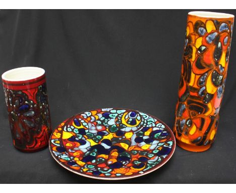 Three Poole Pottery Delphis pattern items comprising of a charger, shape no. 5 measuring 37cm, together with two vases of tap