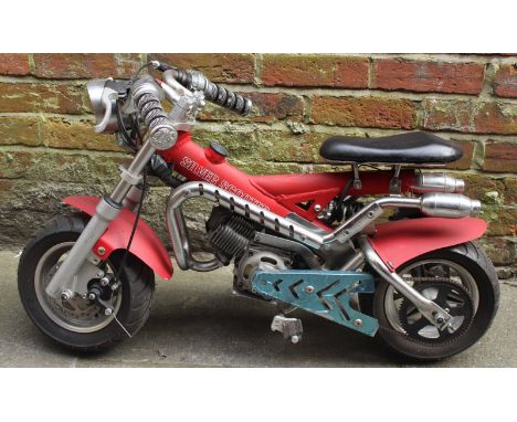 A Mini-Moto custom off-road fun bike, 2-stroke pull-start engine, as new 