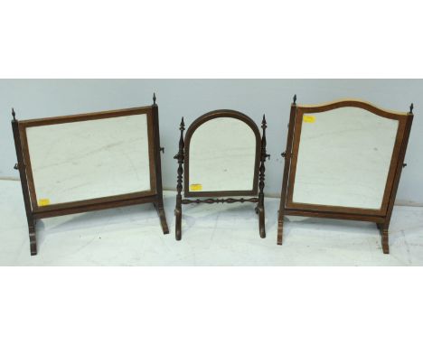 A group of two Victorian mahogany dressing table mirrors, and a later mirror. (3)