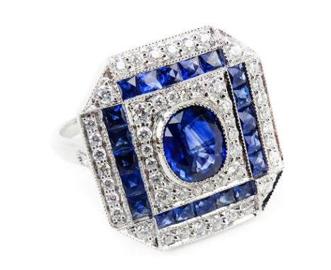 Approx. 2.10 Carat Sapphire, .45 Carat Diamond and Platinum Ring set in the Center with an Approx. 1.09 Carat Oval Cut Sapphi