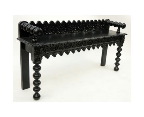 Spanish Colonial Style Painted Carved Wooden Bench. Heavily detailed with spindle arms and feet. Rubbing, nicks. Measures 24-